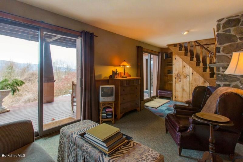 83 Sky Farm Road Copake, NY 12516 - Photo 36 of 38 a living room with furniture and a window