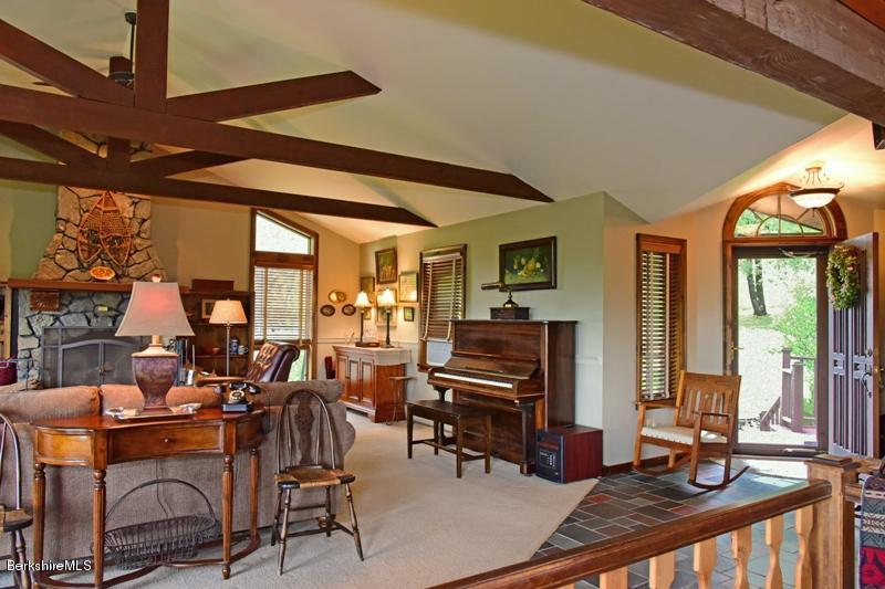 83 Sky Farm Road Copake, NY 12516 - Photo 5 of 38 a room with lots of tables a large window and chairs
