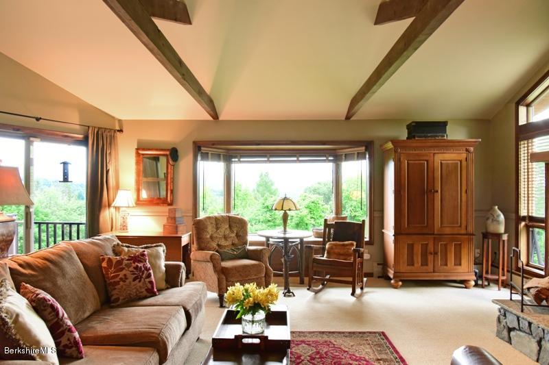 83 Sky Farm Road Copake, NY 12516 - Photo 8 of 38 a living room with furniture and large windows