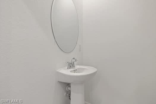 2841 Citrus Street Naples, FL 34120 - Photo 13 of 28 Bathroom featuring a sink