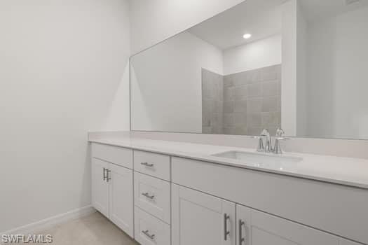 2841 Citrus Street Naples, FL 34120 - Photo 14 of 28 Bathroom featuring vanity and baseboards