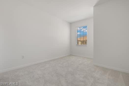 2841 Citrus Street Naples, FL 34120 - Photo 16 of 28 Unfurnished room with carpet flooring and baseboards