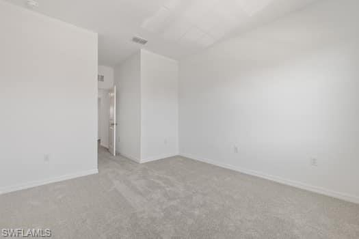 2841 Citrus Street Naples, FL 34120 - Photo 17 of 28 Empty room featuring carpet and lofted ceiling