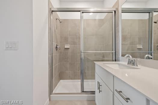 2841 Citrus Street Naples, FL 34120 - Photo 18 of 28 Bathroom featuring vanity and a shower stall