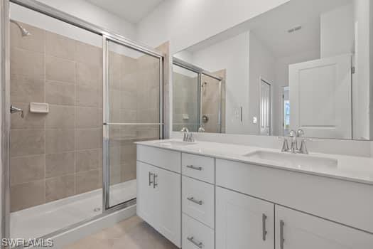 2841 Citrus Street Naples, FL 34120 - Photo 19 of 28 Full bathroom featuring double vanity, a shower stall, and tile patterned floors