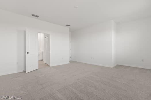 2841 Citrus Street Naples, FL 34120 - Photo 20 of 28 Carpeted spare room with baseboards