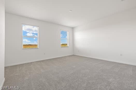2841 Citrus Street Naples, FL 34120 - Photo 23 of 28 Carpeted spare room with healthy amount of natural light