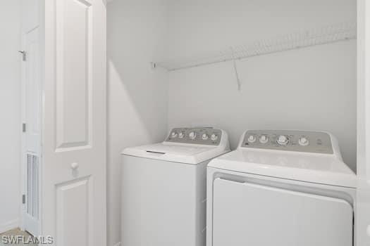 2841 Citrus Street Naples, FL 34120 - Photo 24 of 28 Washroom featuring washing machine and dryer
