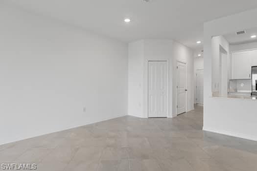 2841 Citrus Street Naples, FL 34120 - Photo 28 of 28 Unfurnished living room featuring recessed lighting