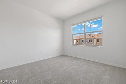 2841 Citrus Street Naples, FL 34120 - Photo 9 of 28 Empty room featuring carpet