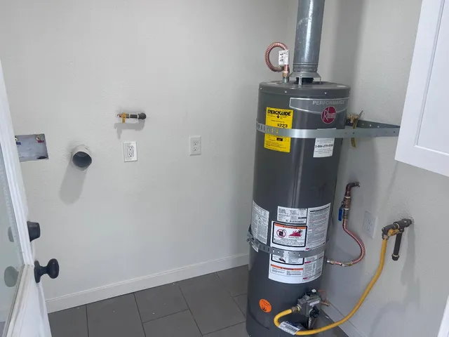 a view of backyard with wooden fence