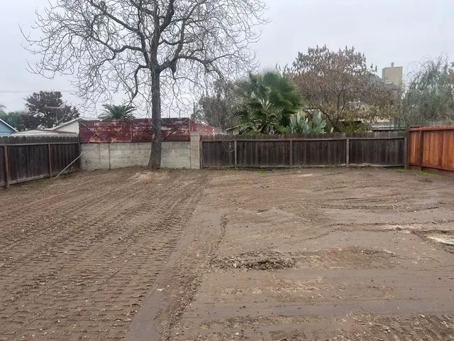 a backyard of a house with trees