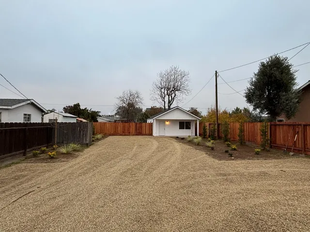 a view of a house with a snow in front of house