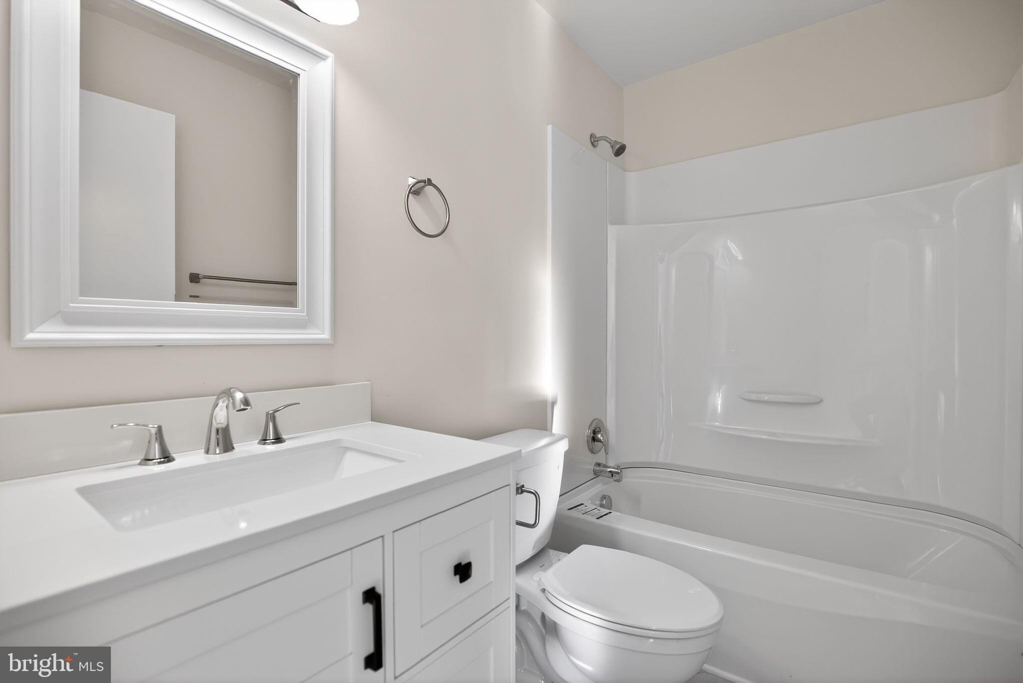 462 East Elmer Road Vineland, NJ 08360 - Photo 16 of 30 a bathroom with a sink a toilet and shower