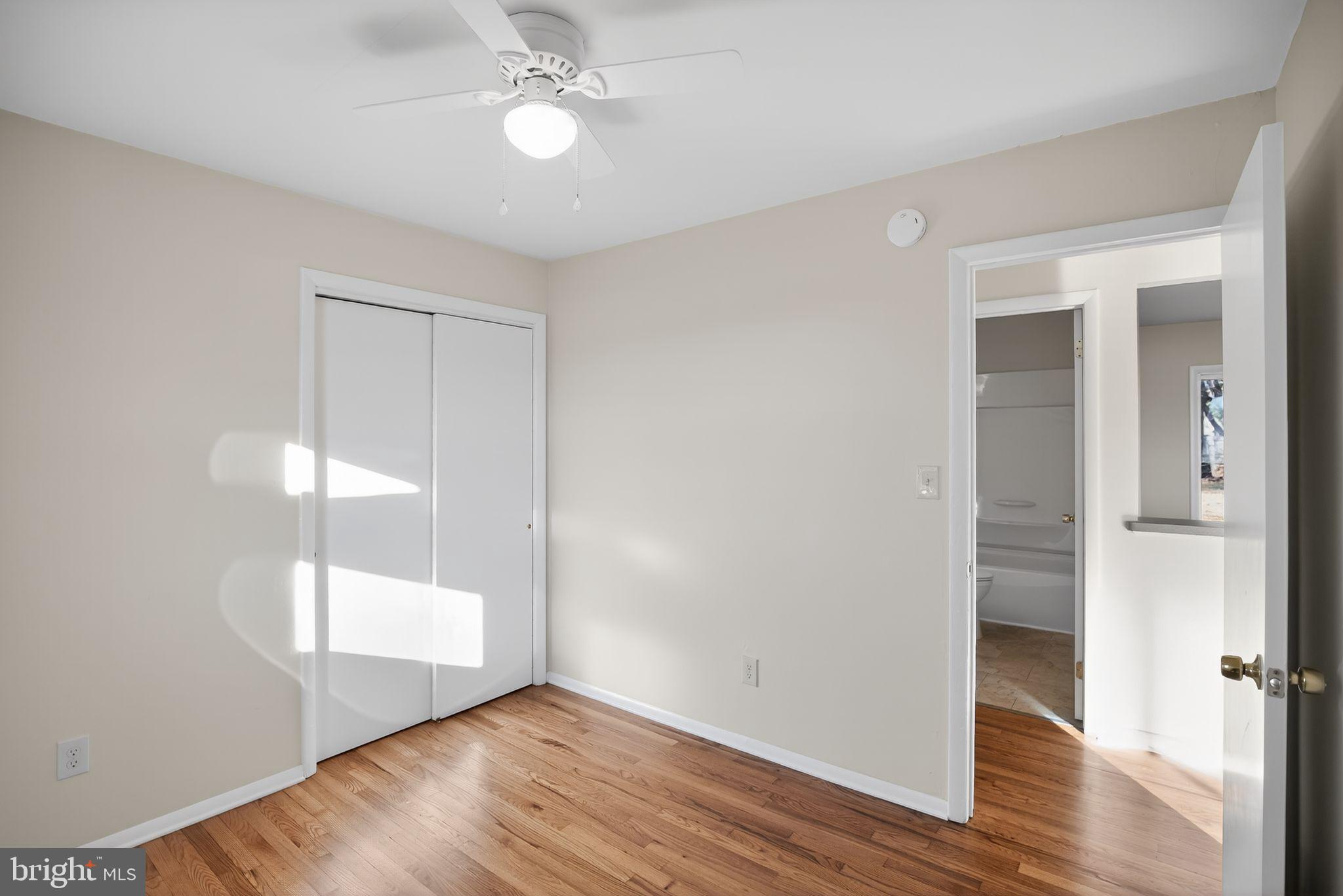 462 East Elmer Road Vineland, NJ 08360 - Photo 17 of 30 wooden floor in an empty room with a window