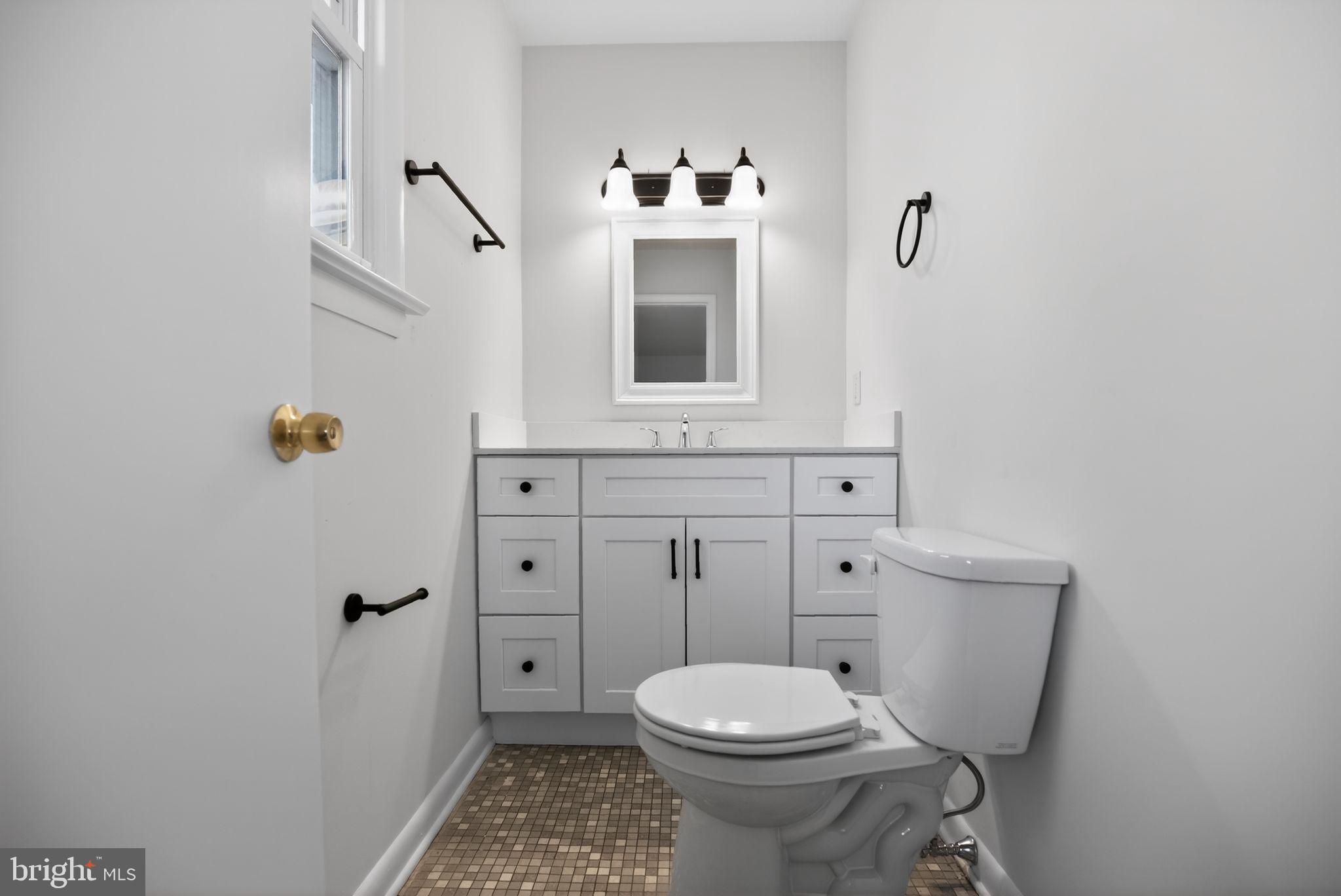 462 East Elmer Road Vineland, NJ 08360 - Photo 19 of 30 a bathroom with a toilet sink and mirror