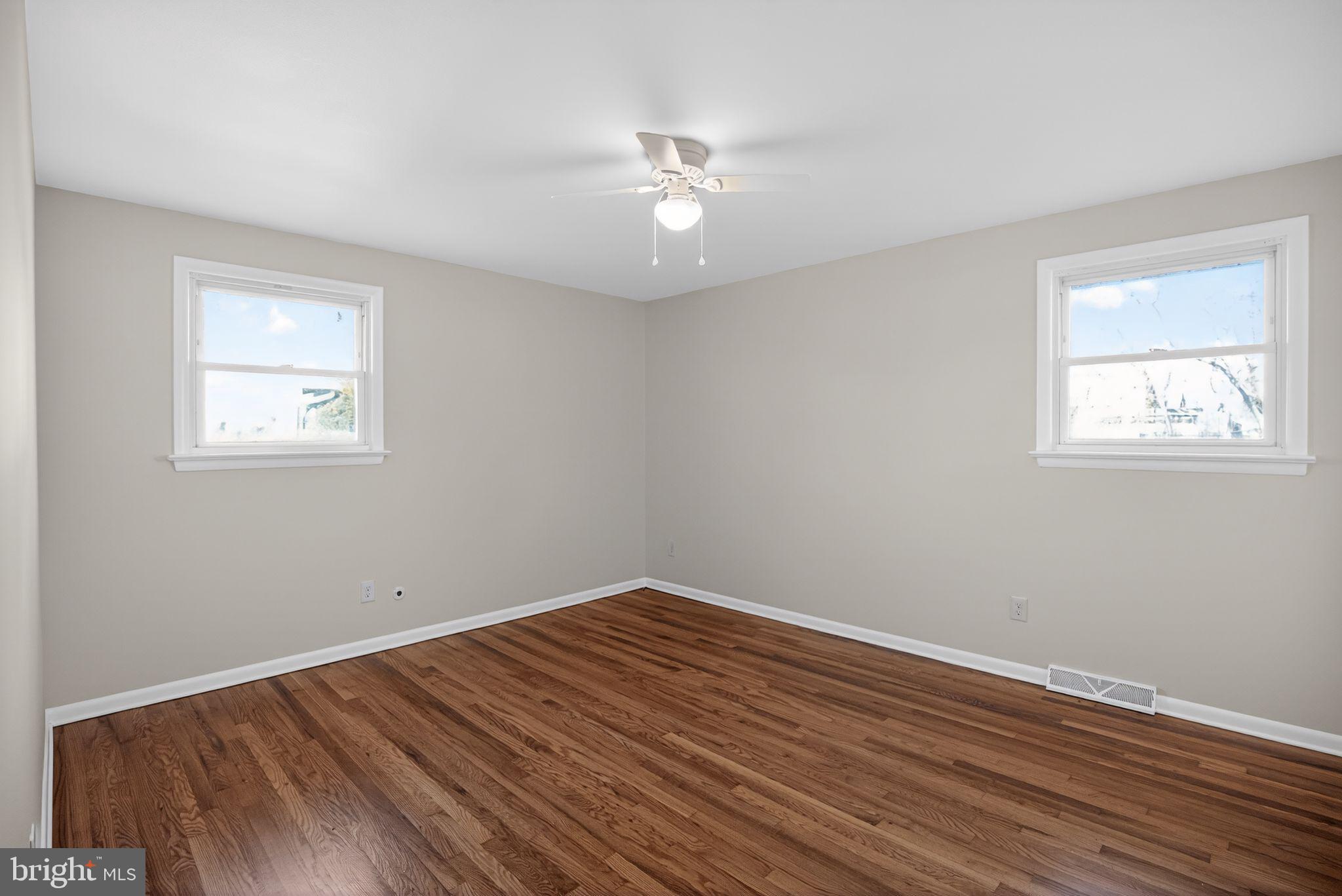 462 East Elmer Road Vineland, NJ 08360 - Photo 21 of 30 a view of empty room with wooden floor and fan