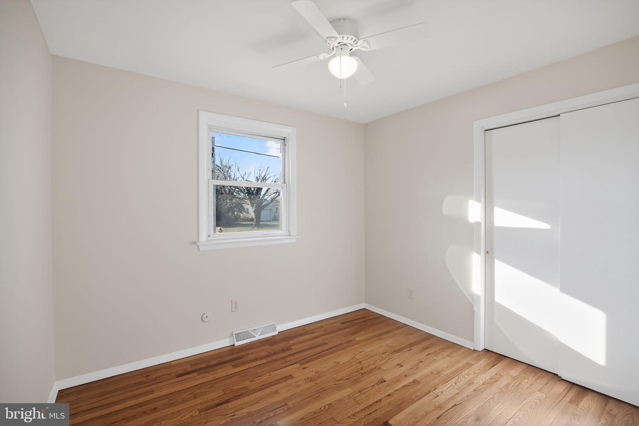 462 East Elmer Road Vineland, NJ 08360 - Photo 22 of 30 wooden floor in an empty room with a window