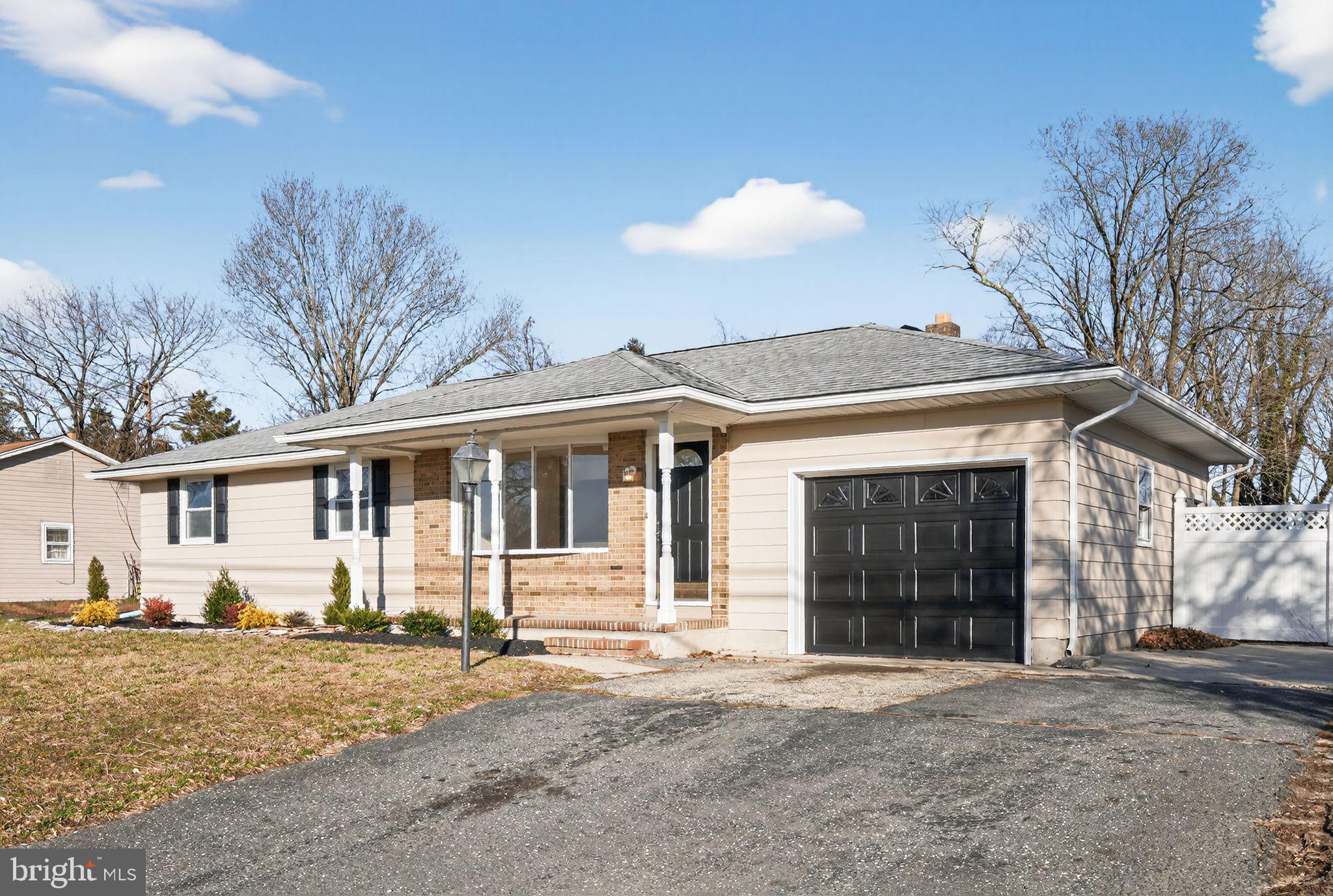 462 East Elmer Road Vineland, NJ 08360 - Photo 26 of 30 a front view of a house with a yard and garage