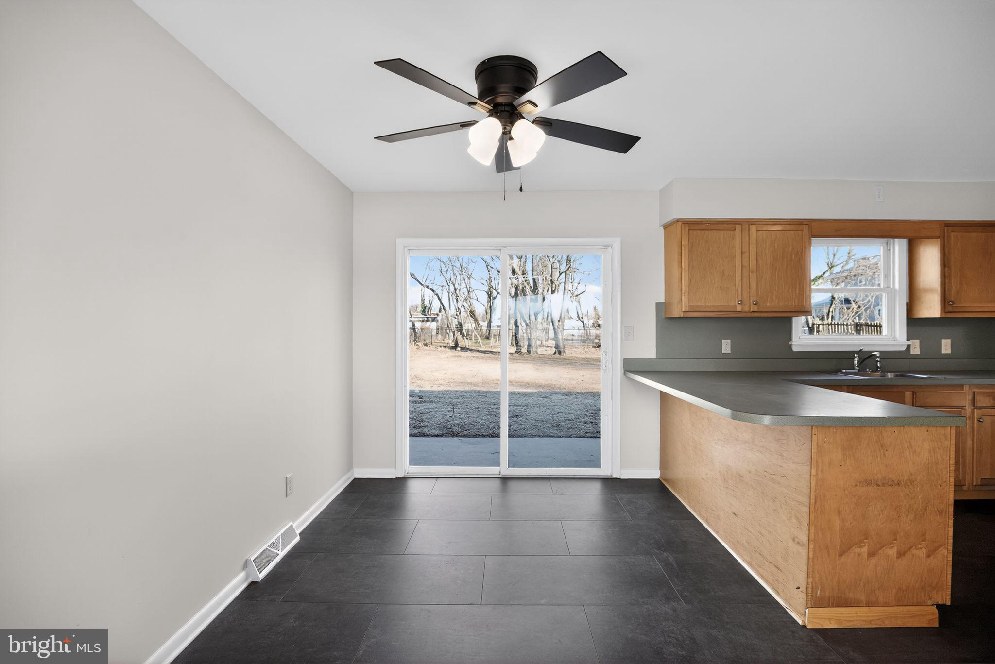 462 East Elmer Road Vineland, NJ 08360 - Photo 7 of 30 a view of a kitchen with a sink and cabinet area