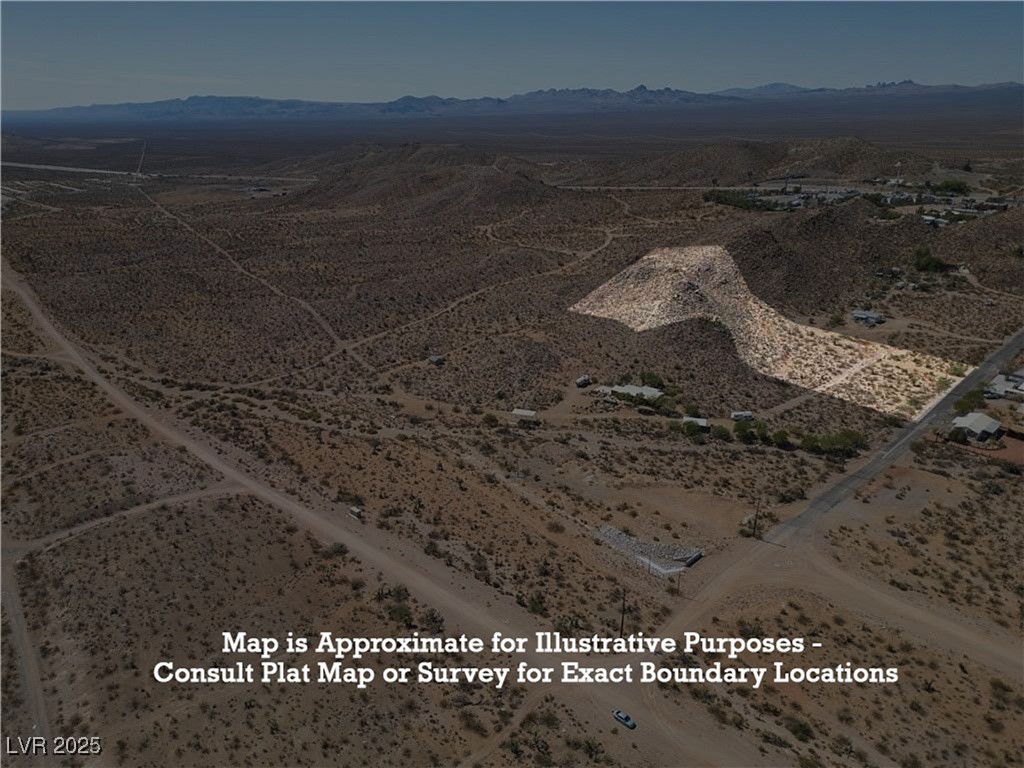 East Hobson Street Searchlight, NV 89046 - Photo 13 of 14 Aerial view of property and surrounding area with a mountain backdrop and rural landscape