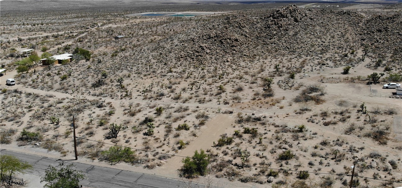 East Hobson Street Searchlight, NV 89046 - Photo 2 of 14 View of rural area featuring a desert landscape and a mountain backdrop