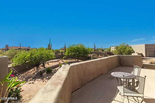 a view of balcony with furniture