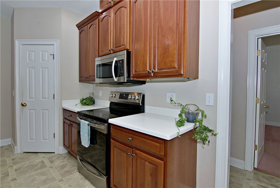 7893 Athens Road Carnesville, GA 30521 - Photo 13 of 50 This functional kitchen features ample cabinetry and modern appliances, perfect for daily living.
