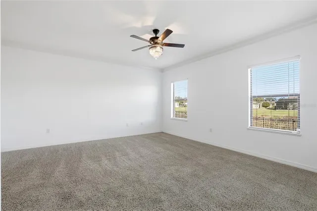 an empty room with window and windows