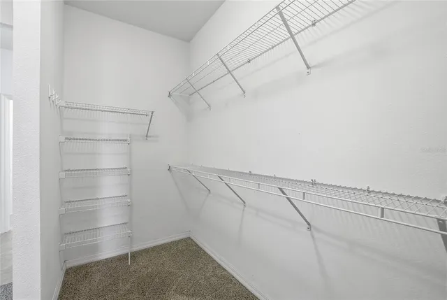 a view of a room with racks on the wall