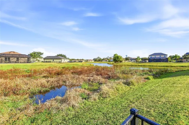 a view of a lake with a big yard