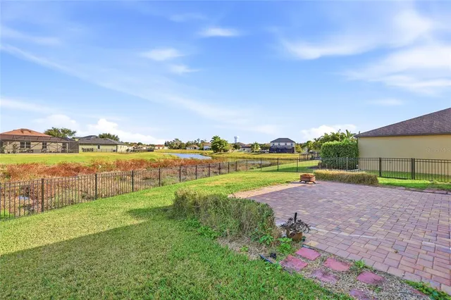 a view of a lake with houses in the background