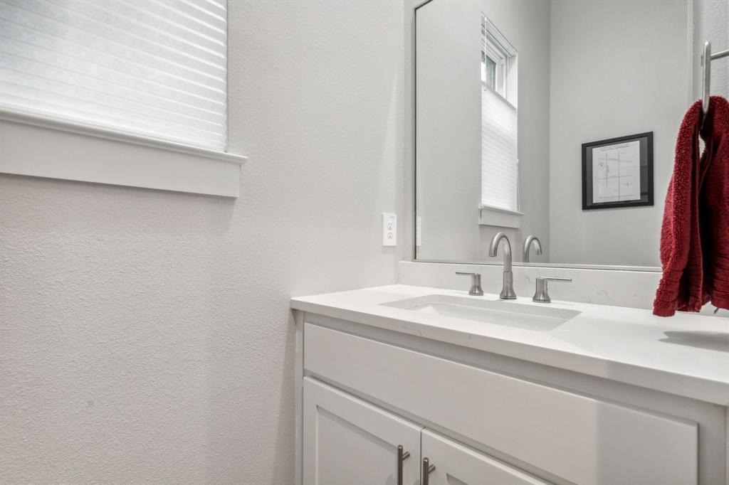 4109 Maison Ridge Dallas, TX 75219 - Photo 14 of 39 a bathroom with a sink and a mirror