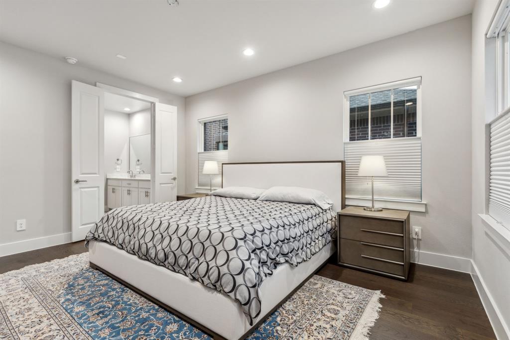 4109 Maison Ridge Dallas, TX 75219 - Photo 16 of 39 a bedroom with a bed and a window with balcony