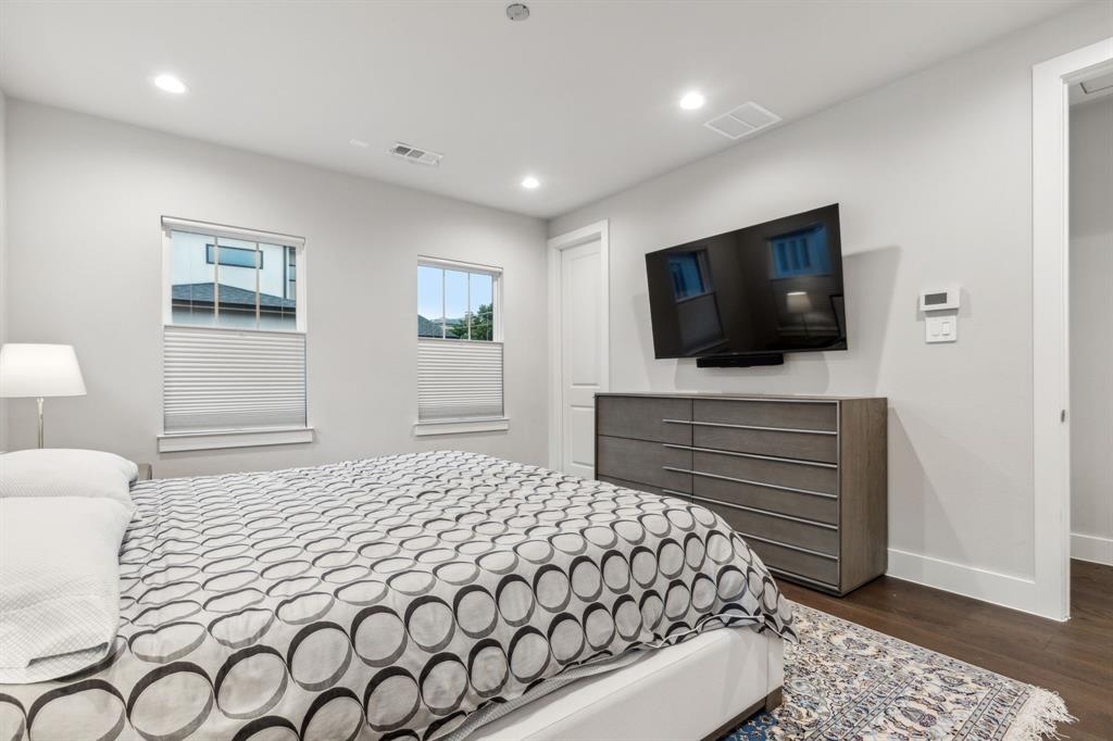 4109 Maison Ridge Dallas, TX 75219 - Photo 18 of 39 a bedroom with a bed and a flat screen tv