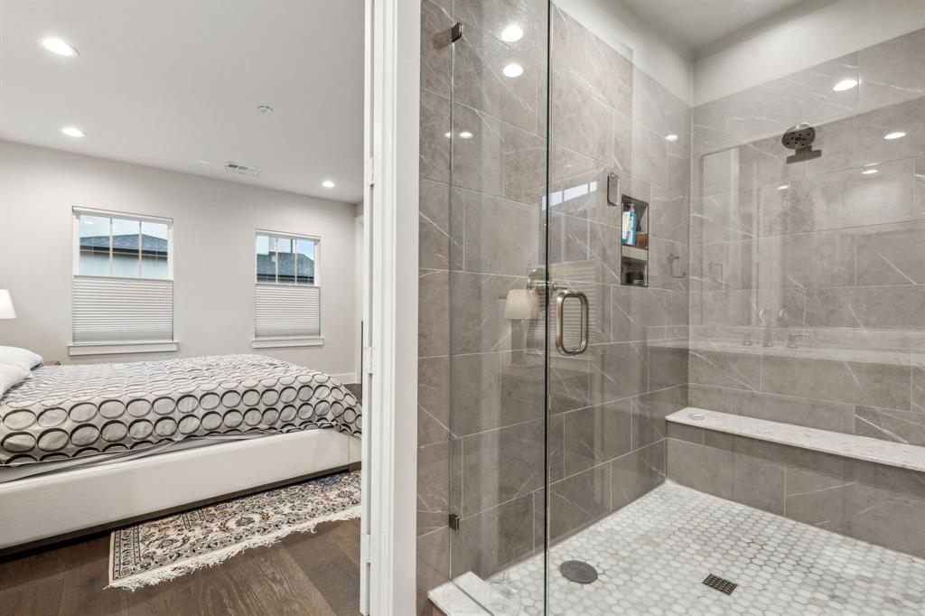 4109 Maison Ridge Dallas, TX 75219 - Photo 22 of 39 a bathroom with a bathtub and a shower