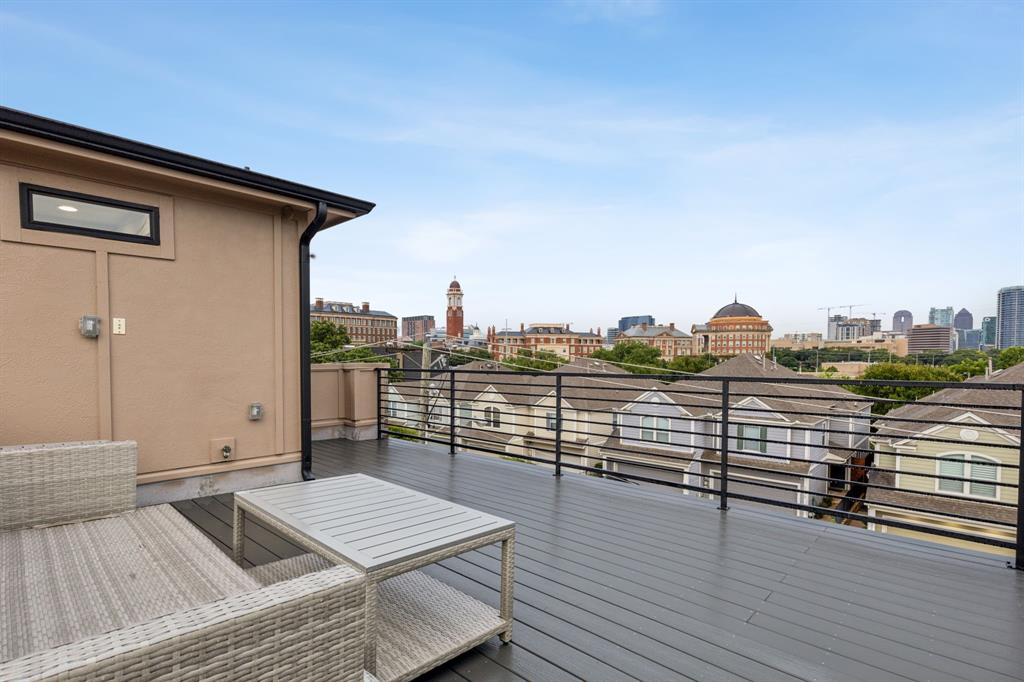 4109 Maison Ridge Dallas, TX 75219 - Photo 27 of 39 a view of a terrace with wooden floor and city view