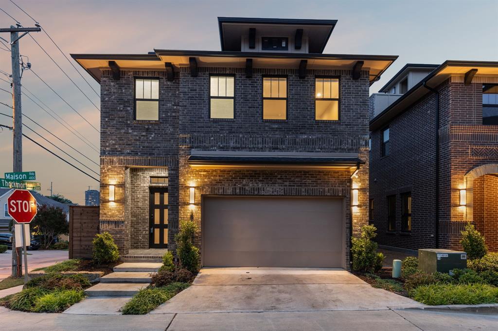 4109 Maison Ridge Dallas, TX 75219 - Photo 33 of 39 a front view of a house with a garage
