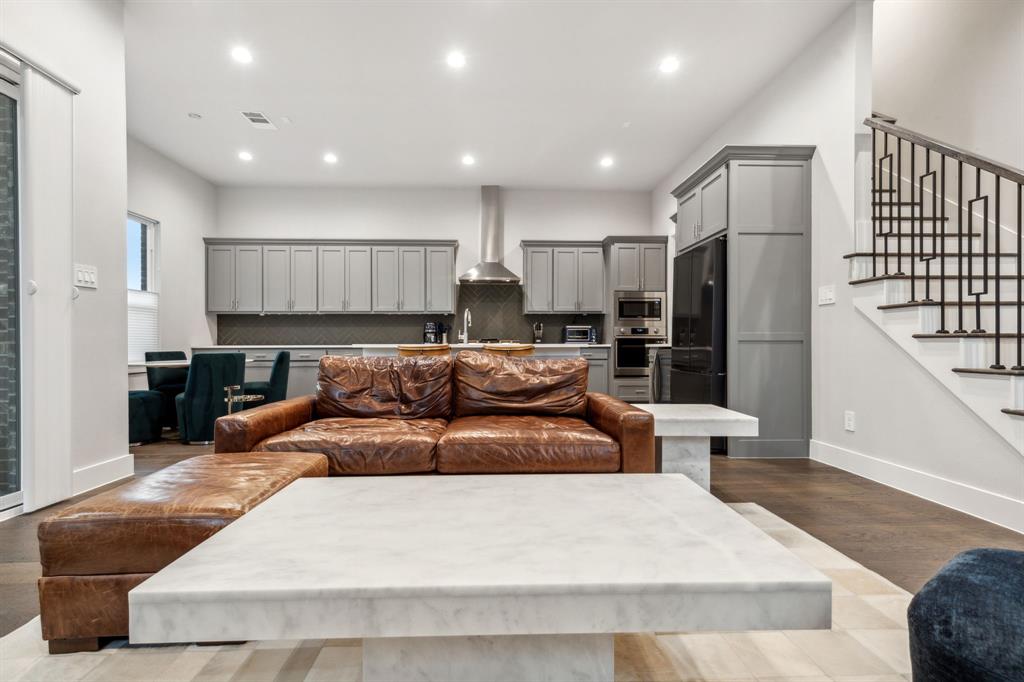 4109 Maison Ridge Dallas, TX 75219 - Photo 5 of 39 a large kitchen with stainless steel appliances kitchen island granite countertop a refrigerator and a sink