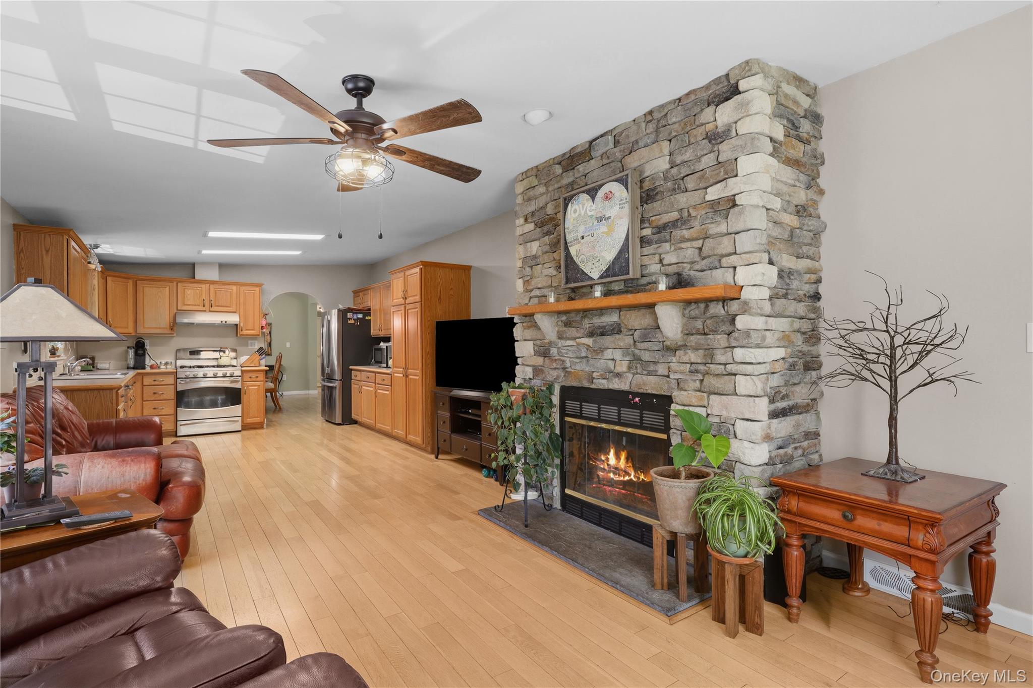 590 Farm To Market Road Brewster, NY 10509 - Photo 24 of 32 a living room with furniture a flat screen tv and a fireplace