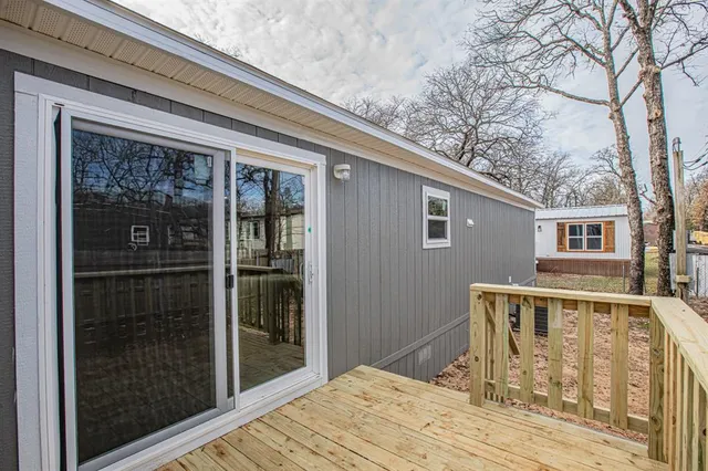 a view of a house with a yard covered in snow