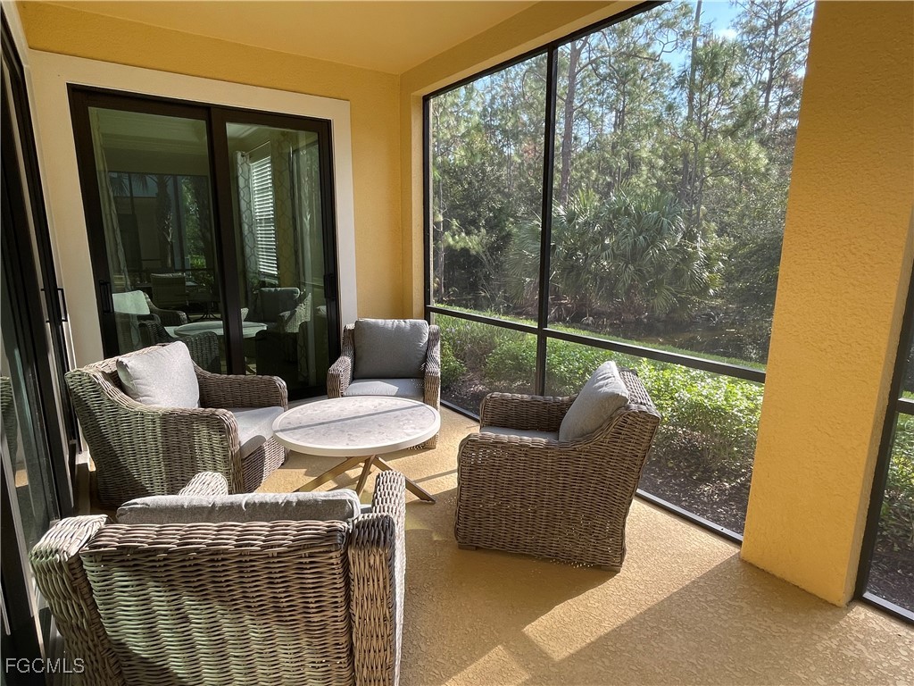 10529 Casella Way, Unit 102 Fort Myers, FL 33913 - Photo 5 of 14 a living room with furniture and a window