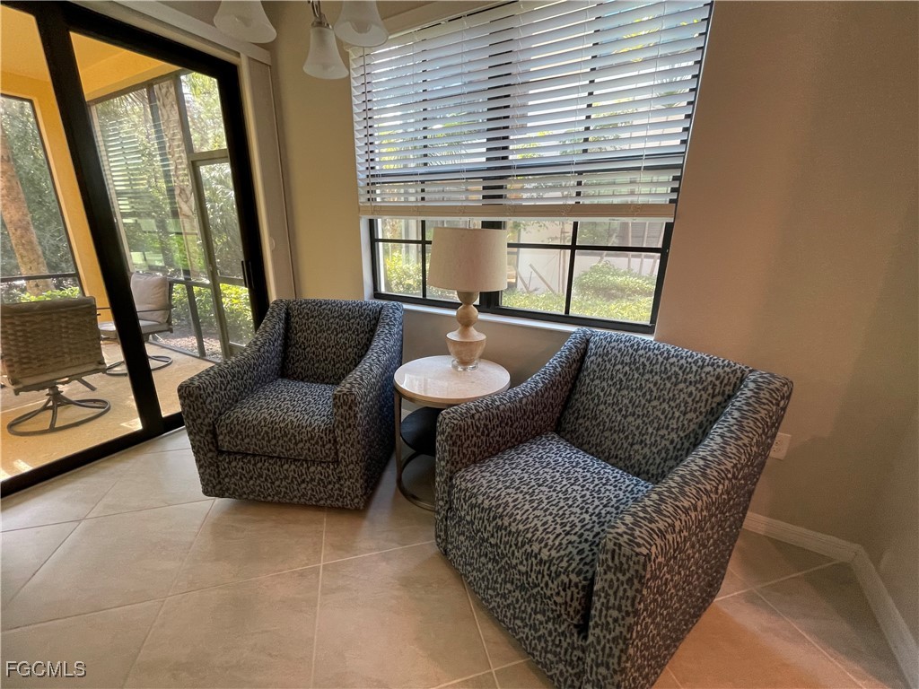 10529 Casella Way, Unit 102 Fort Myers, FL 33913 - Photo 6 of 14 a living room with furniture and a window