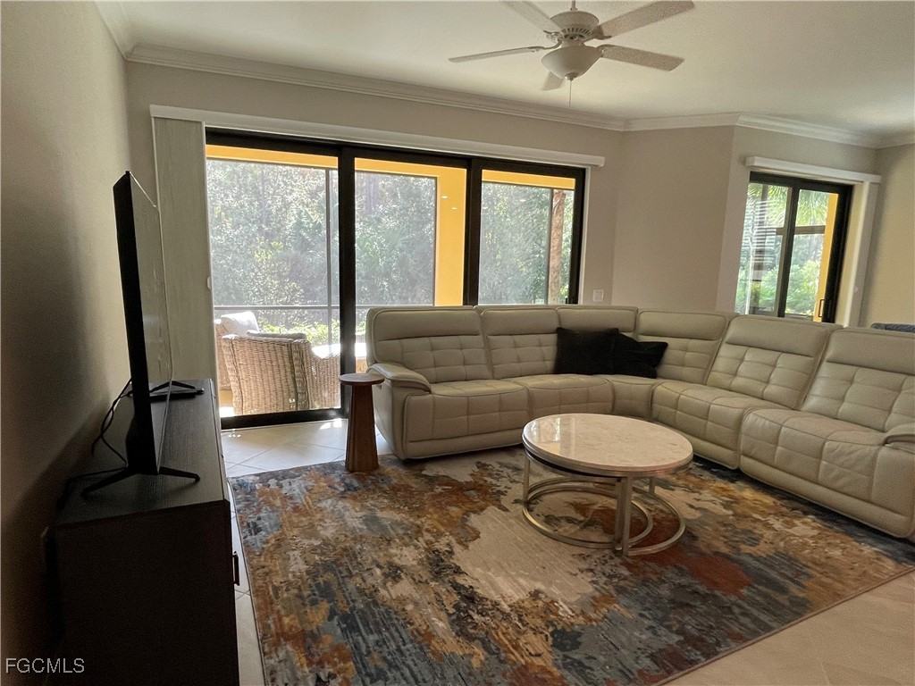 10529 Casella Way, Unit 102 Fort Myers, FL 33913 - Photo 7 of 14 a living room with furniture and a large window
