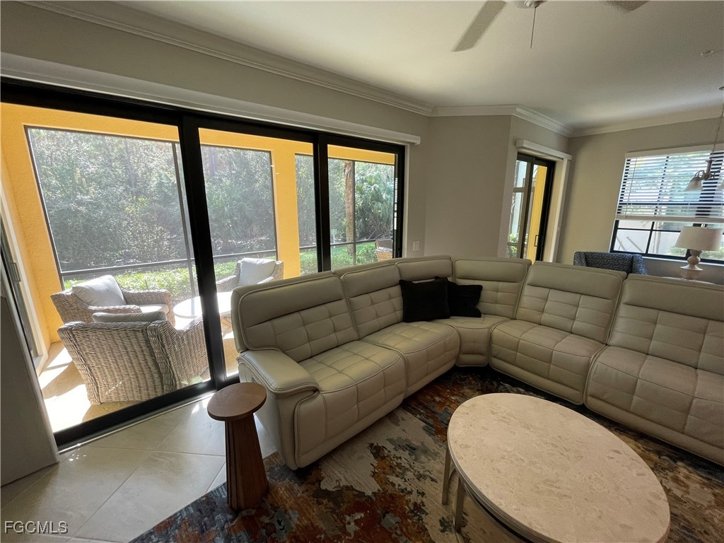 10529 Casella Way, Unit 102 Fort Myers, FL 33913 - Photo 9 of 14 a living room with furniture and a large window