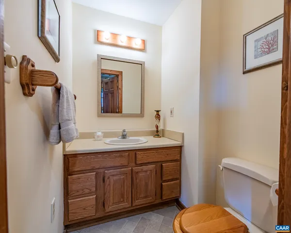 a spacious bedroom with a bed and a chandelier
