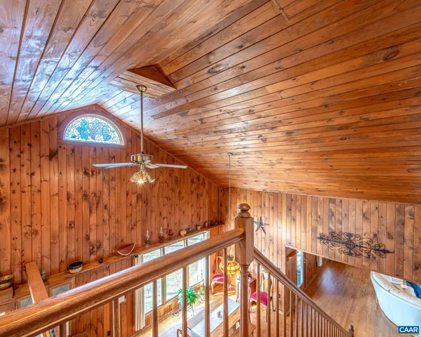 a spacious bedroom with a bed and a couch