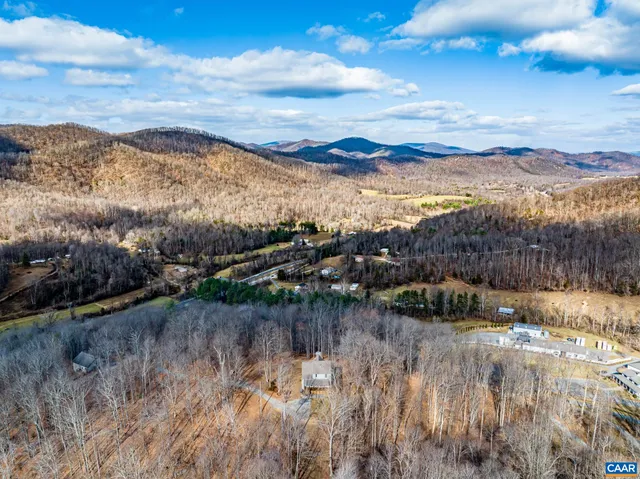 a view of outdoor space with deck and trees