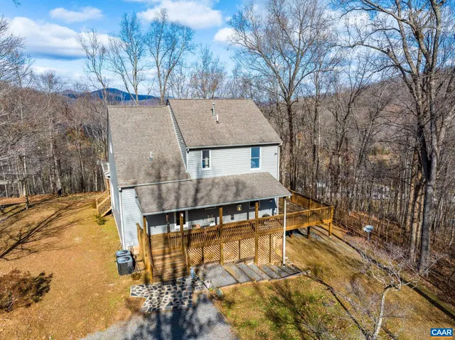 a view of balcony with wooden floor and outdoor seating