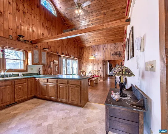 a kitchen with stainless steel appliances granite countertop a sink and cabinets